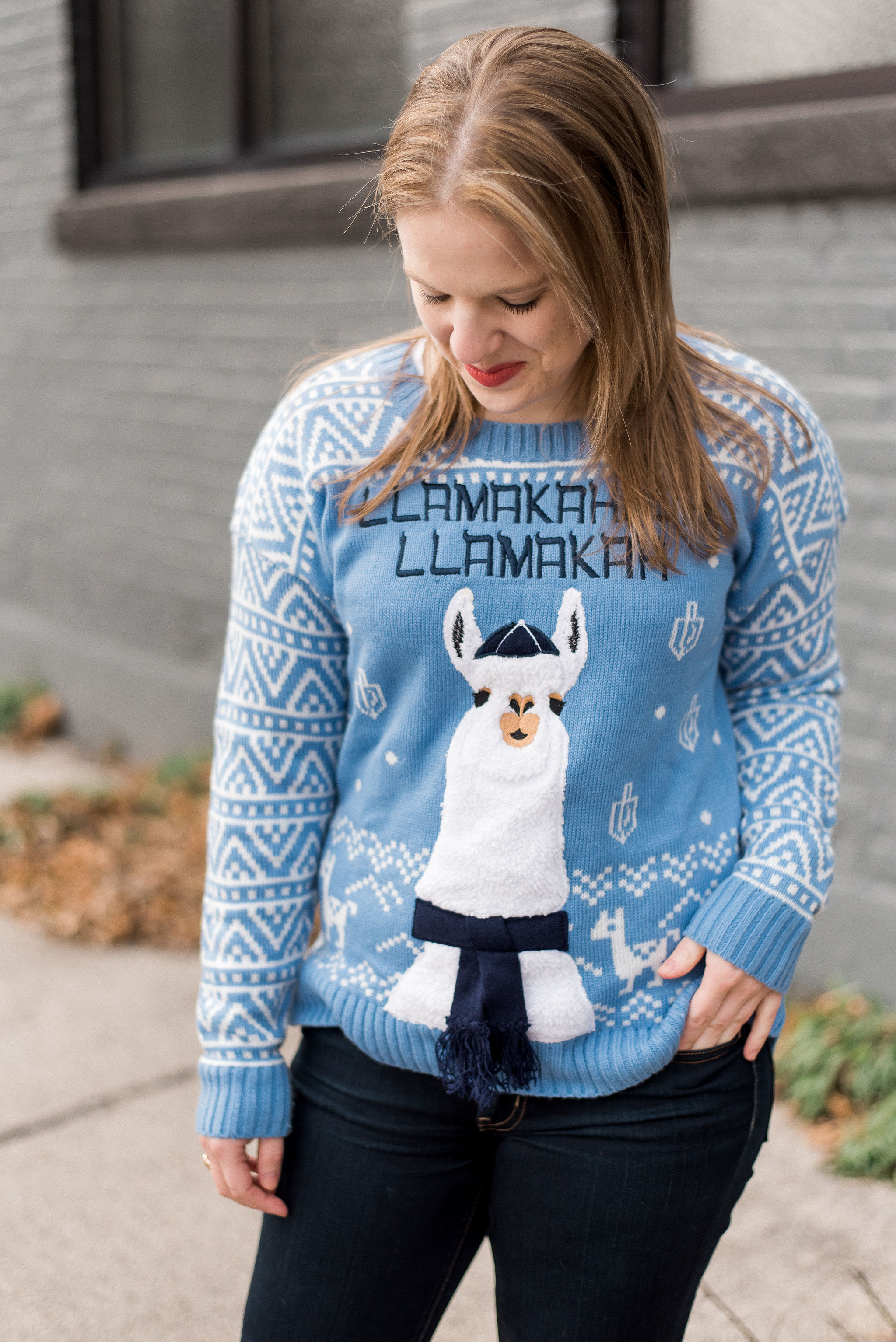 woman blogger wearing ugly llama hanukkah sweater