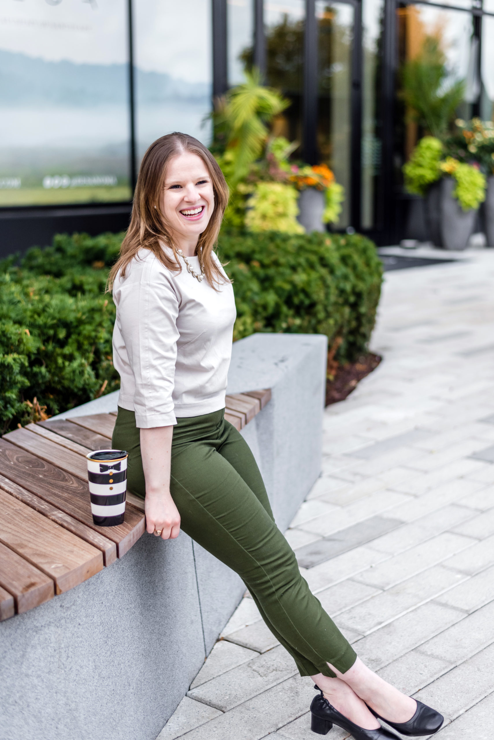 woman blogger wearing green skinny jeans with Everlane day heel