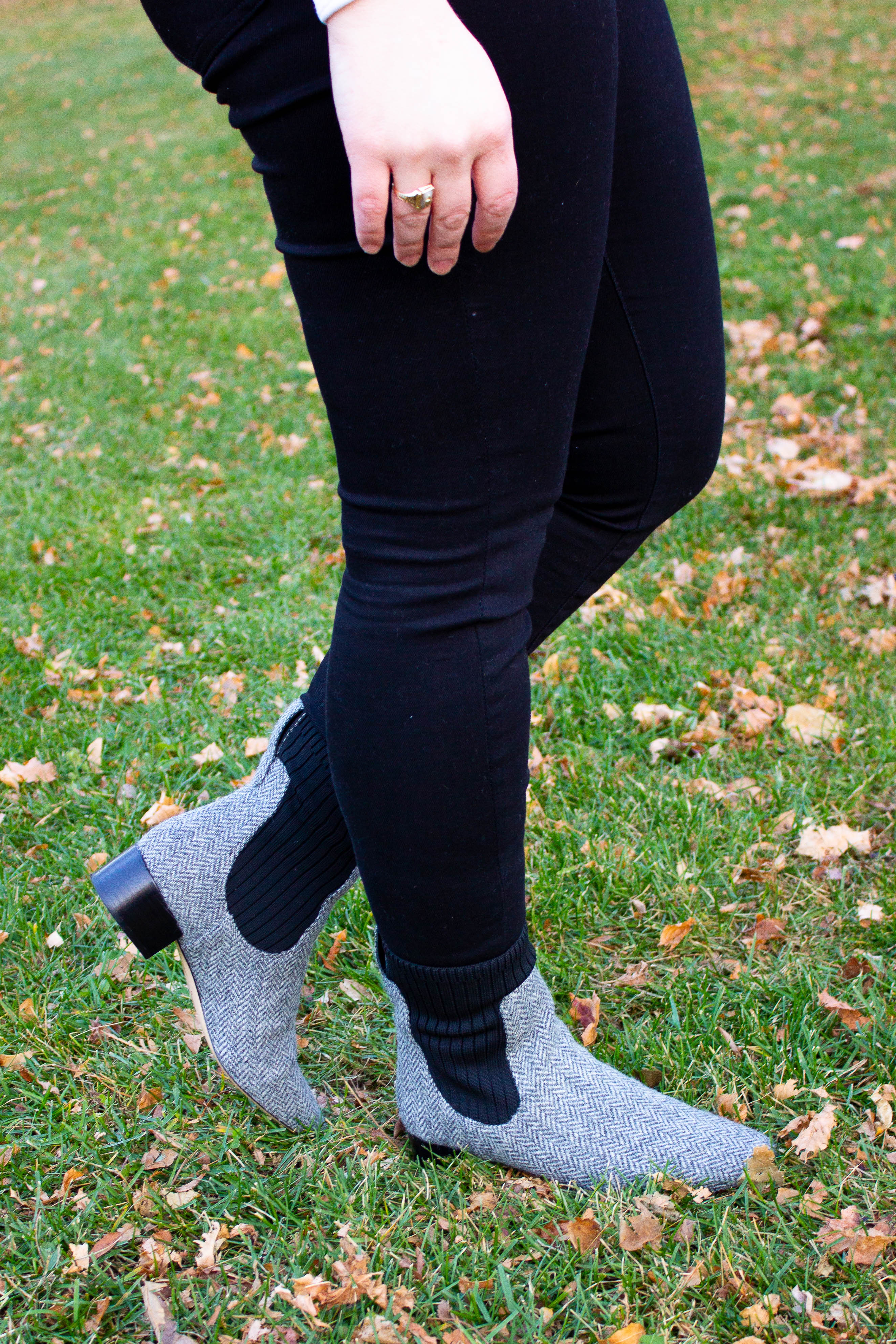 woman blogger wearing Everlane black denim and J.Crew ankle boots