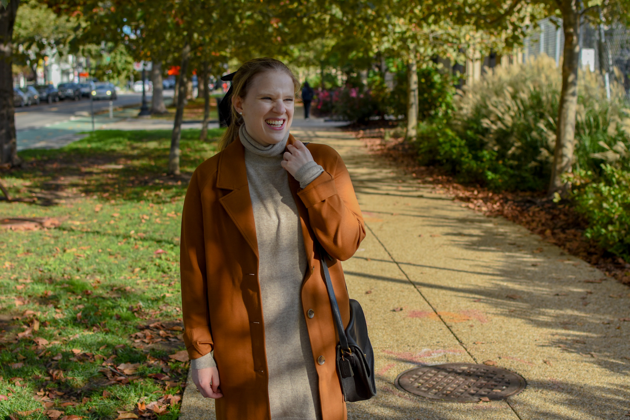 woman blogger wearing Everlane turtleneck dress under trenchcoat