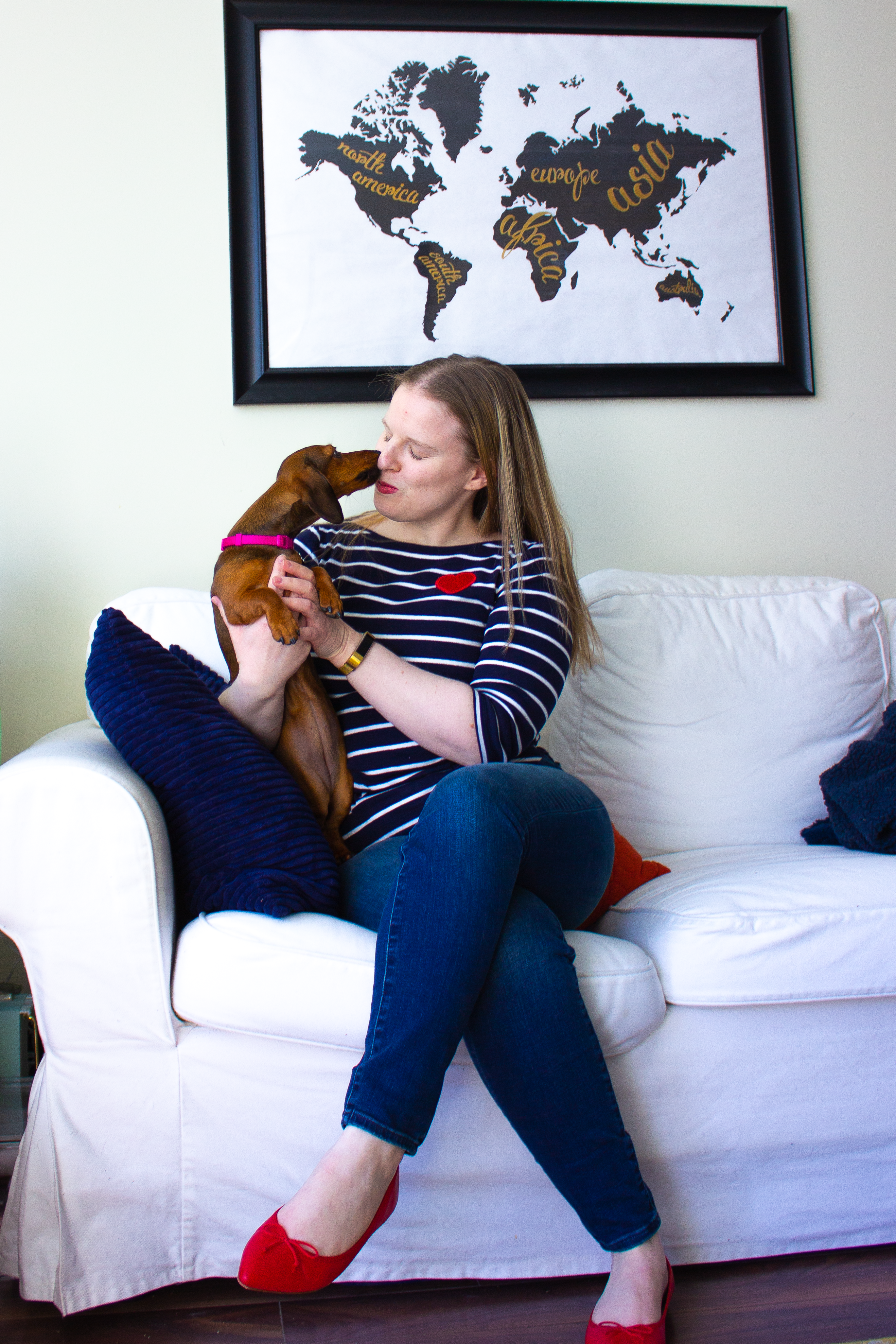 woman blogger with dog on couch for valentine's day