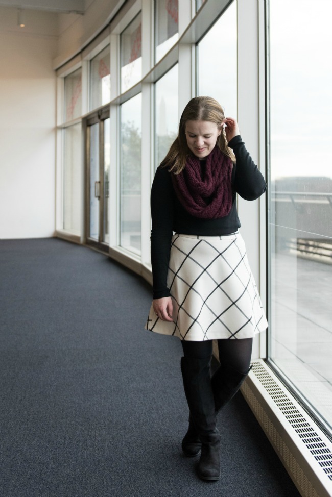DC woman blogger wearing white skirt with tall boots