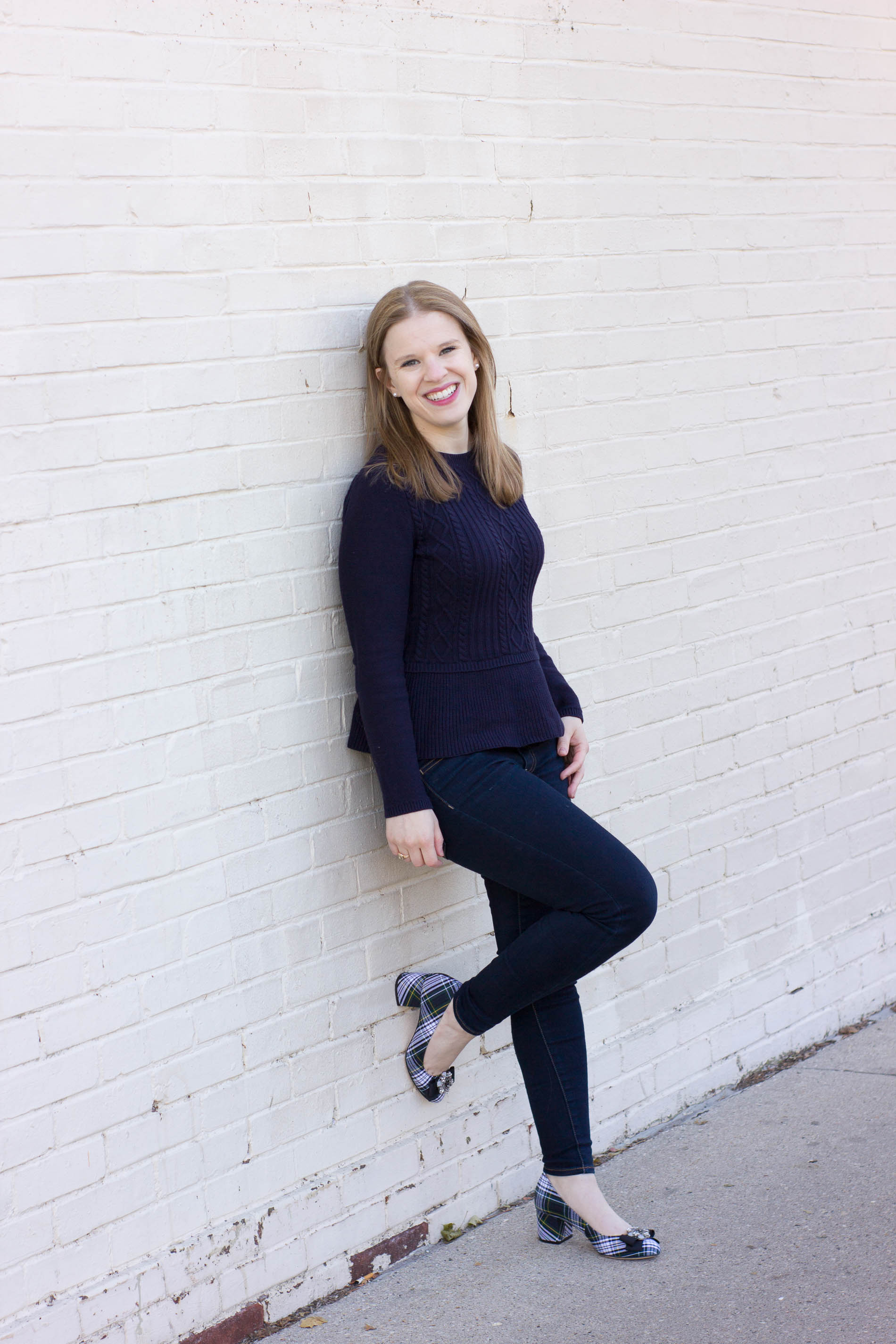 woman wearing blue top and jeans for Cute Thanksgiving Outfit Ideas