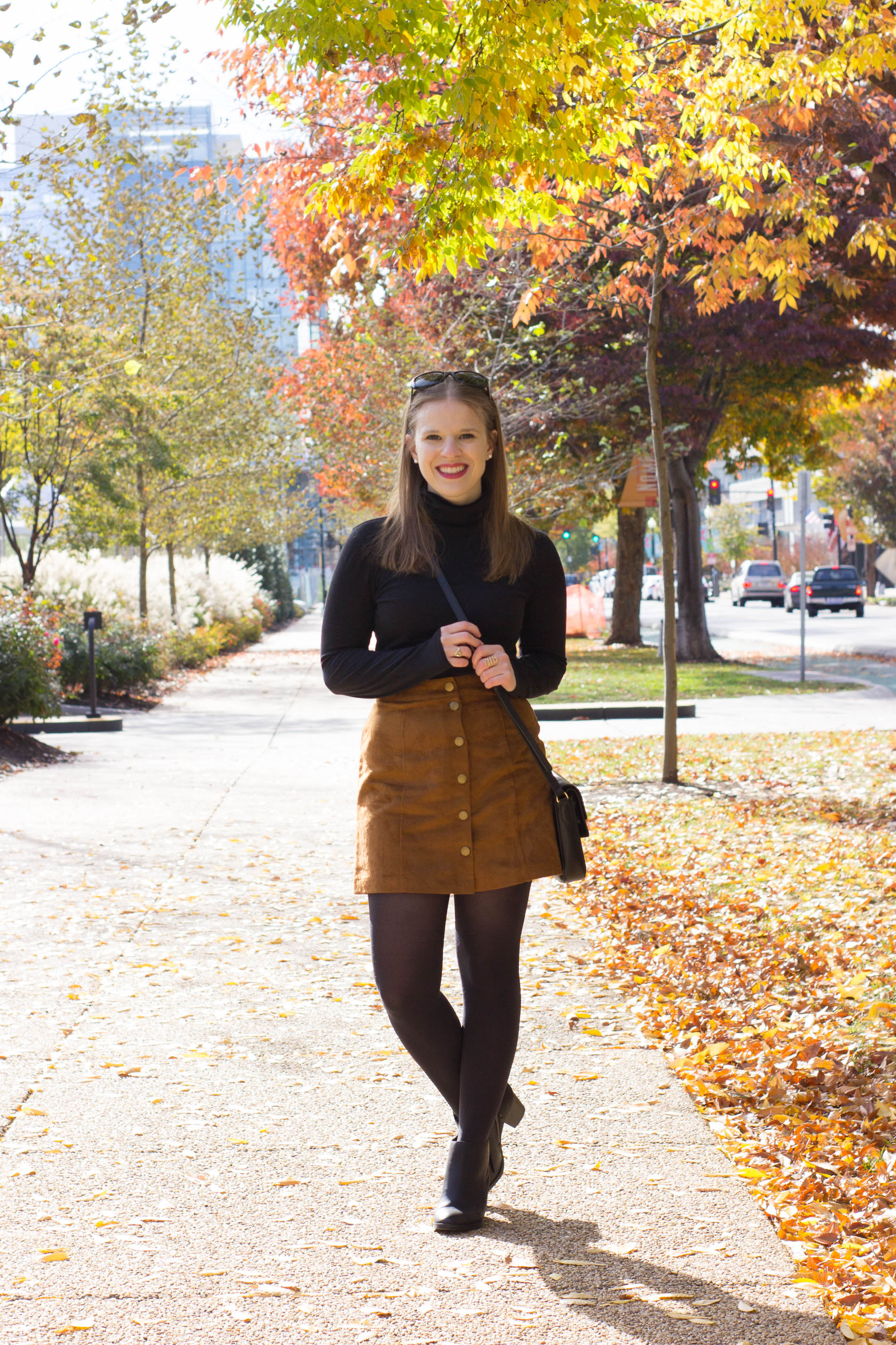 woman wearing turtle neck top and skirt 