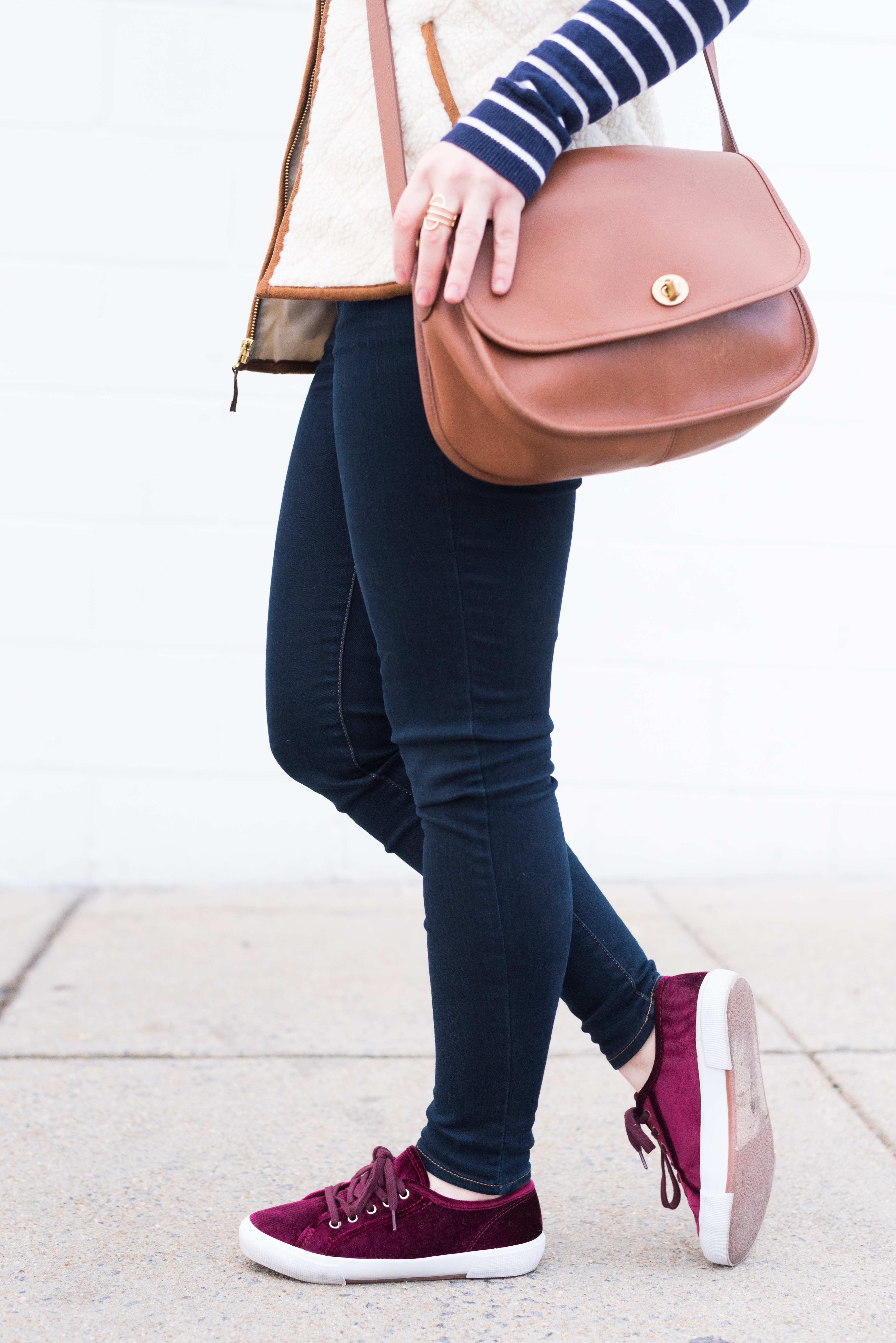 What I Learned From You | Something Good, @danaerinw, burgundy shoes, tennis shoes, sneakers, cranberry shoes, coach bag, crossbody bag, aeo jeans, fur vest, skinny denim