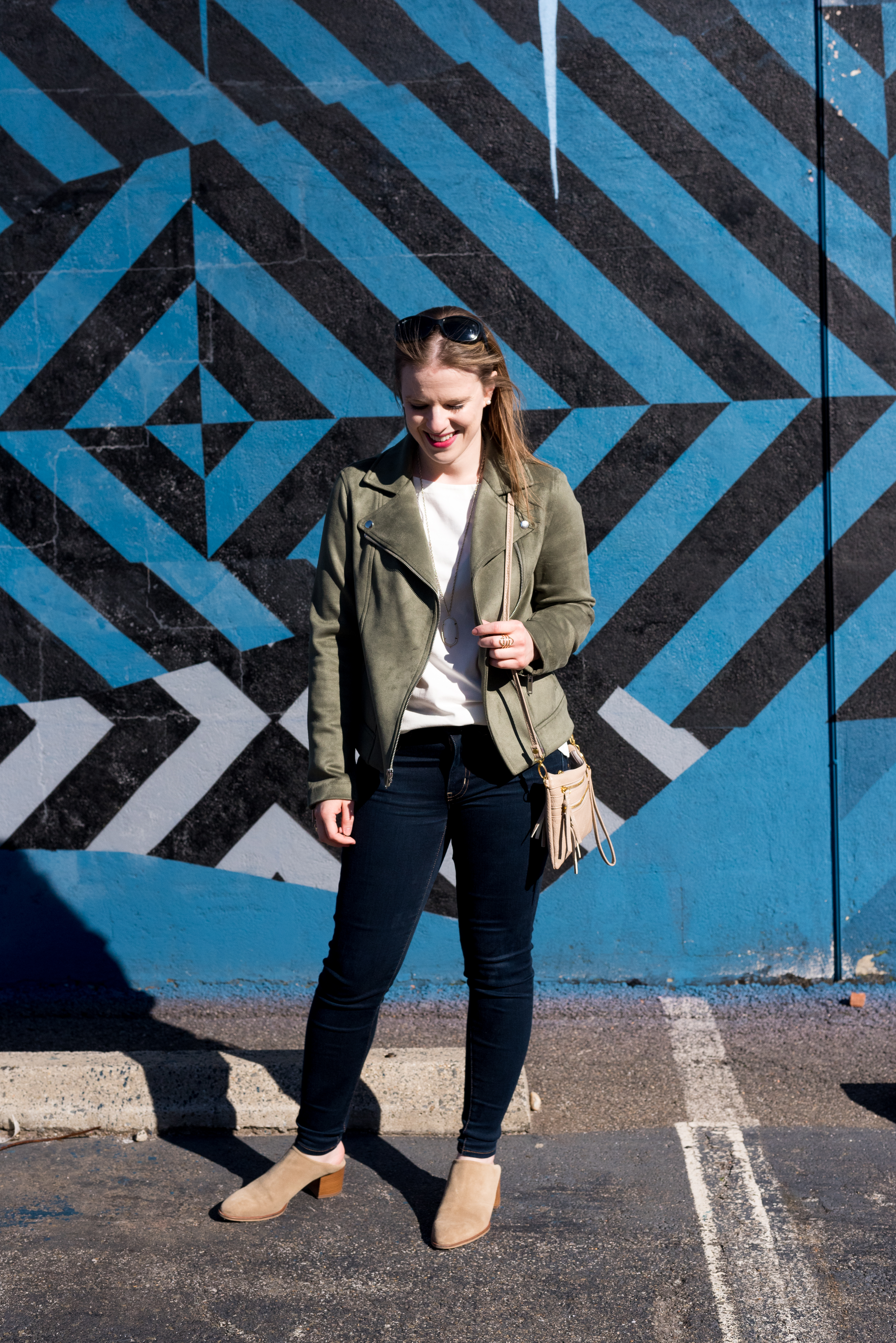 women wearing AEO Denim X Jegging, white top, and jacket one of the Outfits to Wear With Clogs