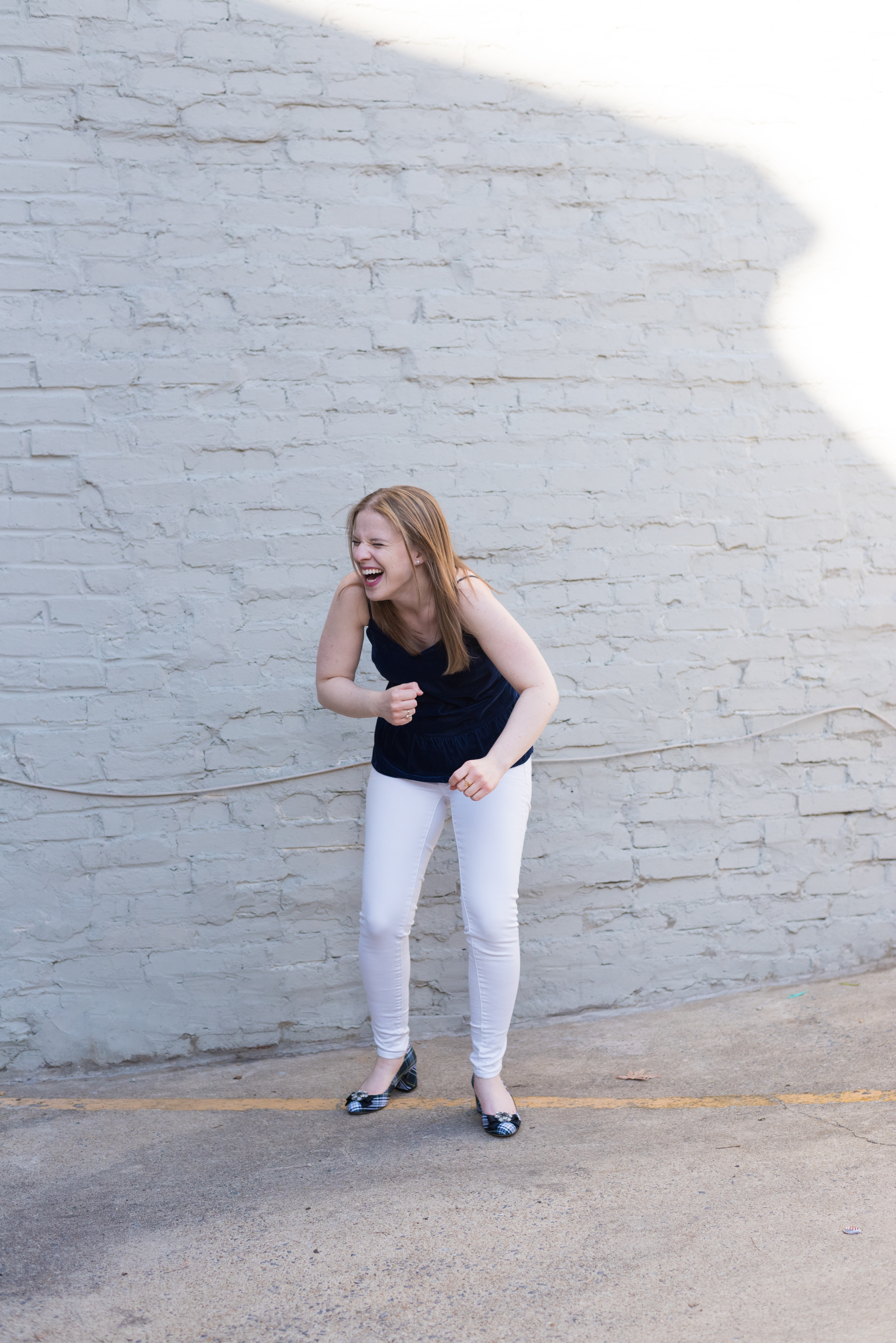 girl dancing and falling over laughing