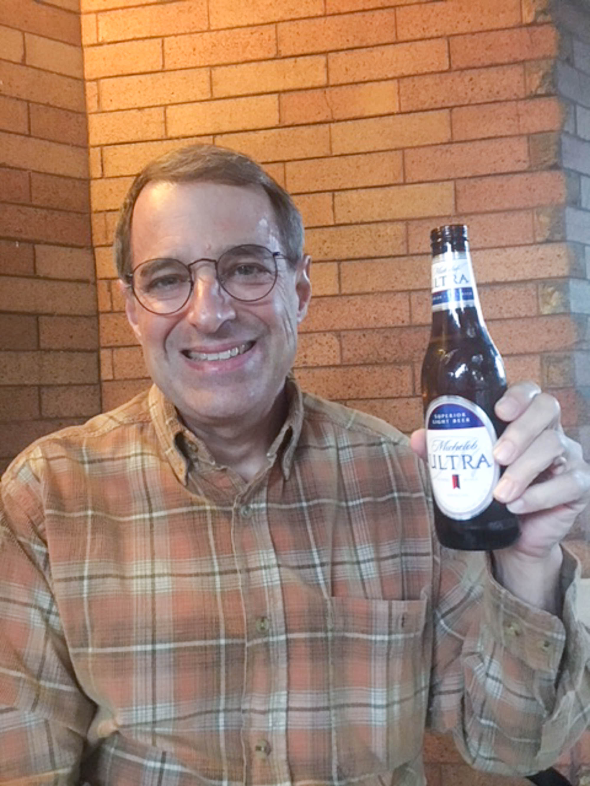 man with Michelob ULTRA light beer