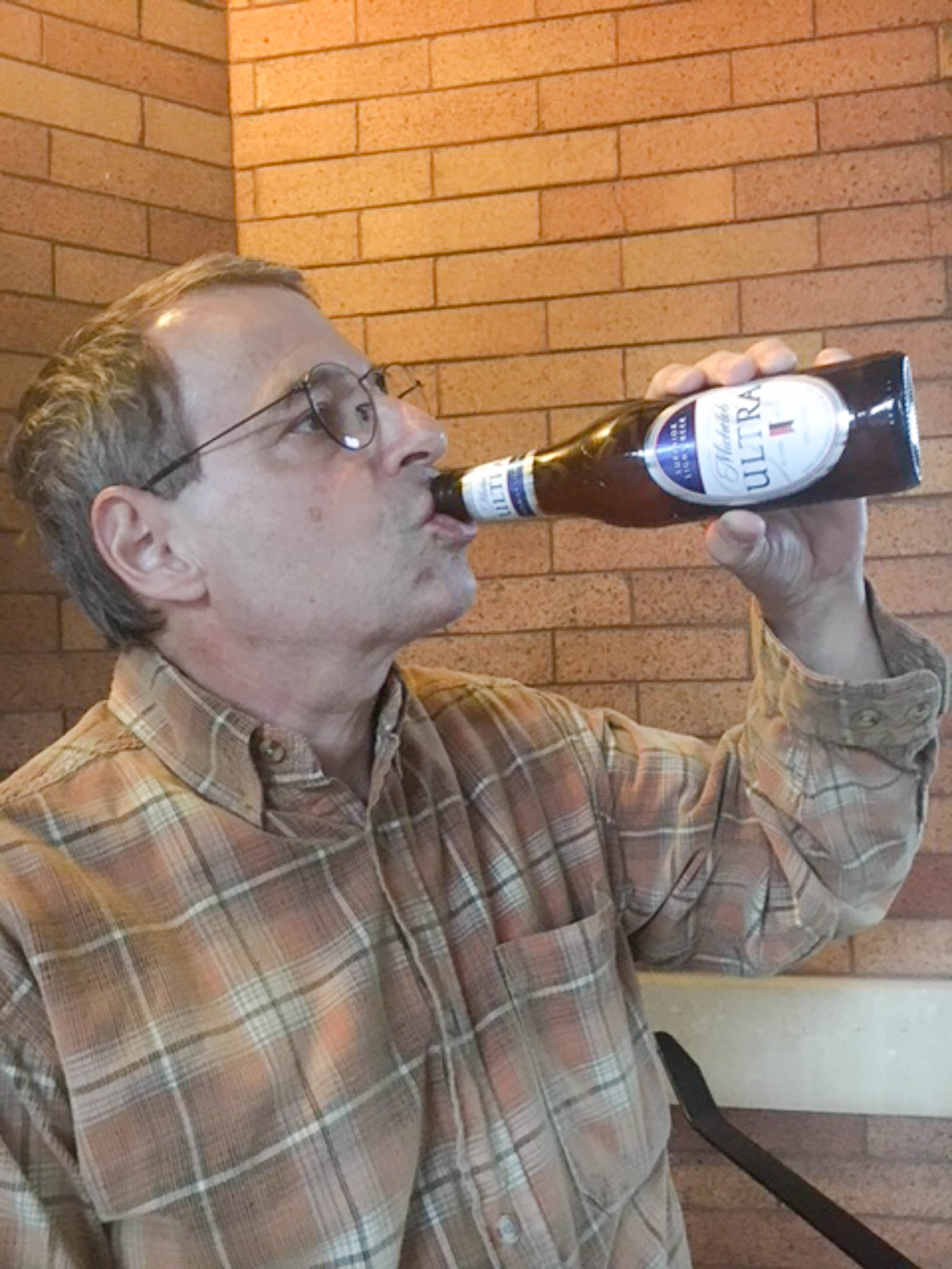 man with Michelob ULTRA light beer