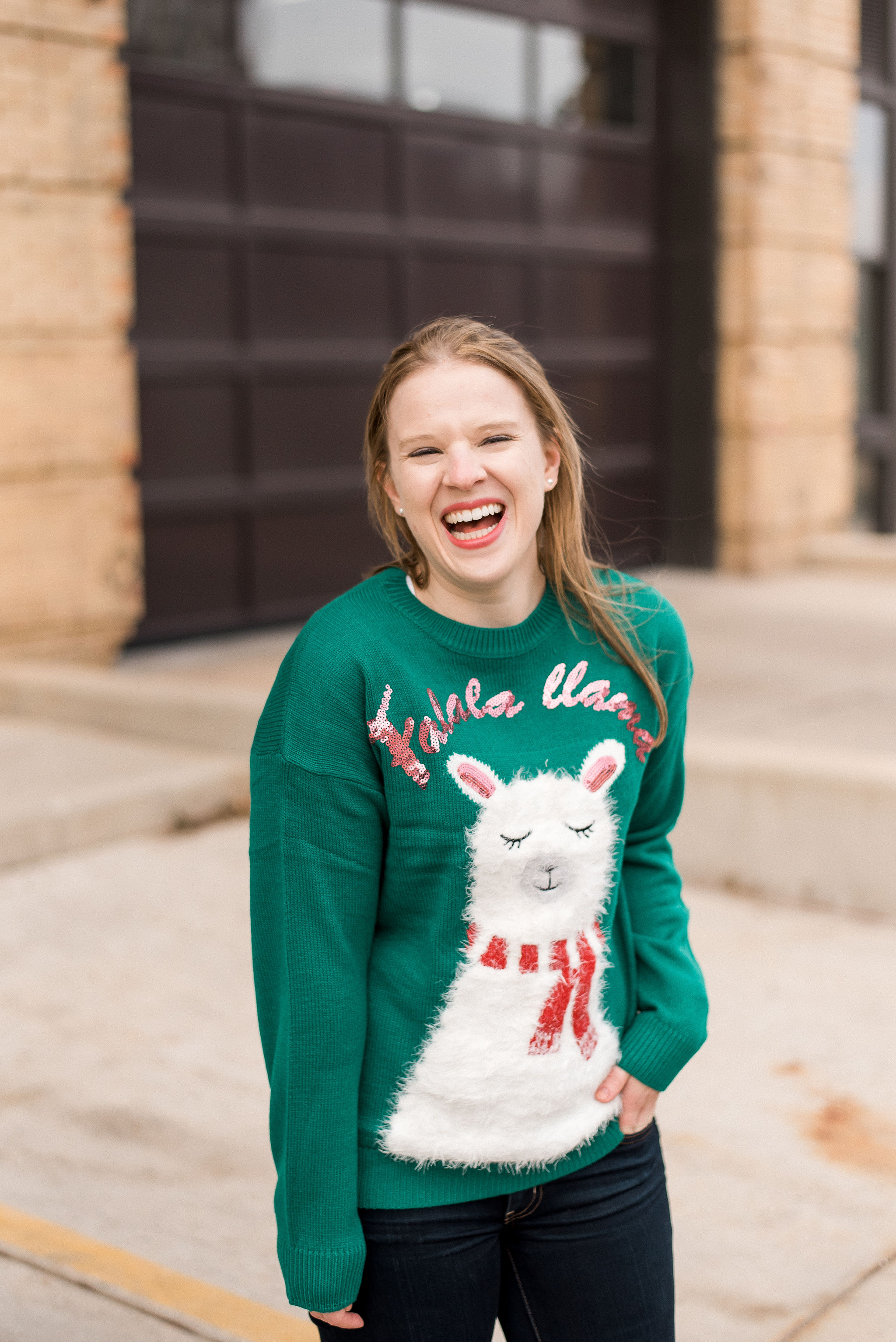 DC woman blogger wearing New Look christmas sweater with llama print in green