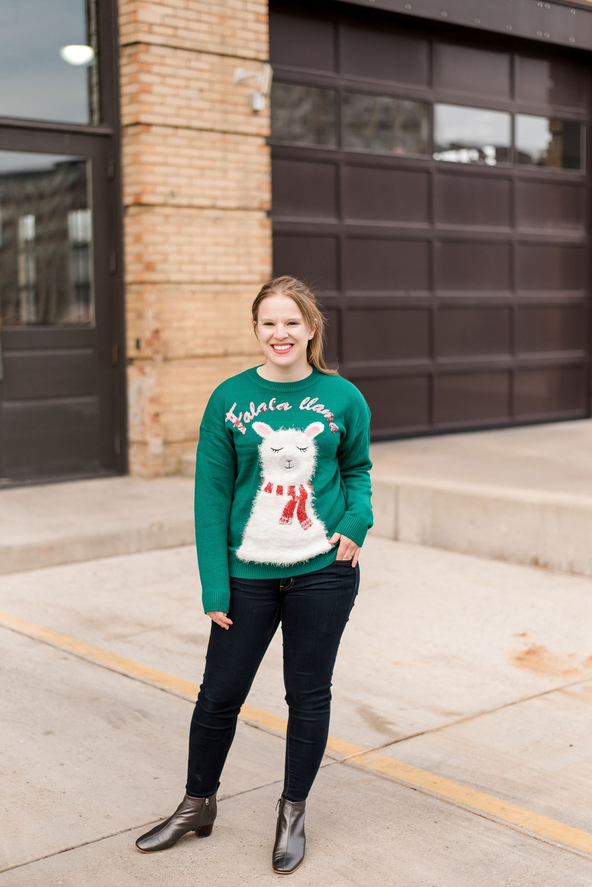 DC woman blogger wearing New Look christmas sweater with llama print in green