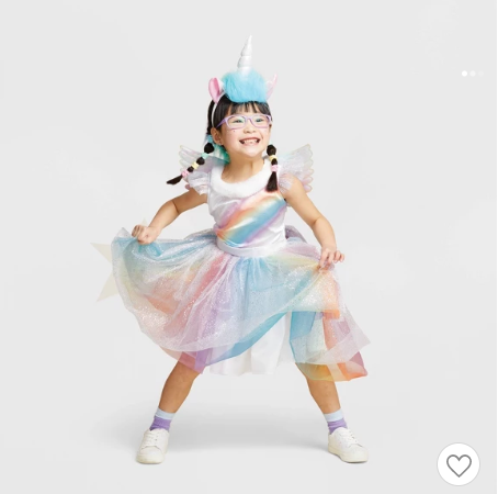 Girl in rainbow unicorn costume