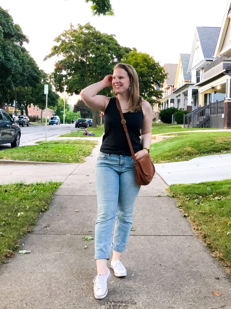 woman blogger wearing jeans and Converse shoes