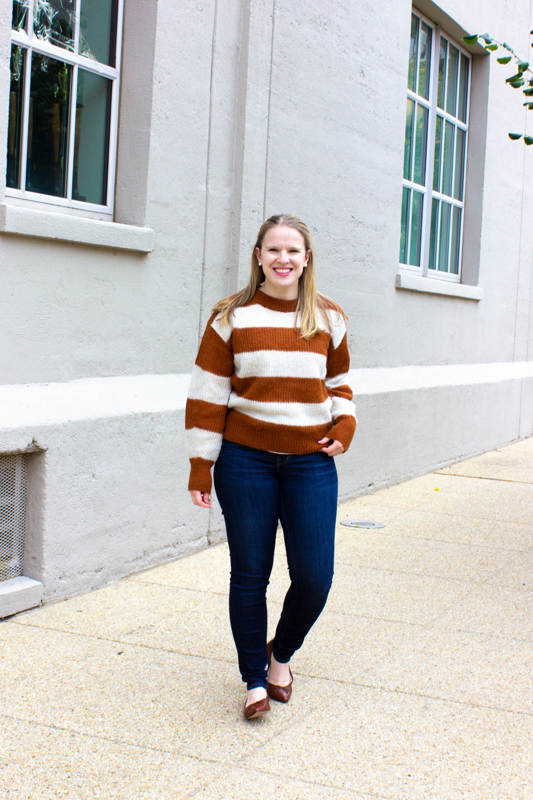 woman blogger wearing Everlane sweater and flats