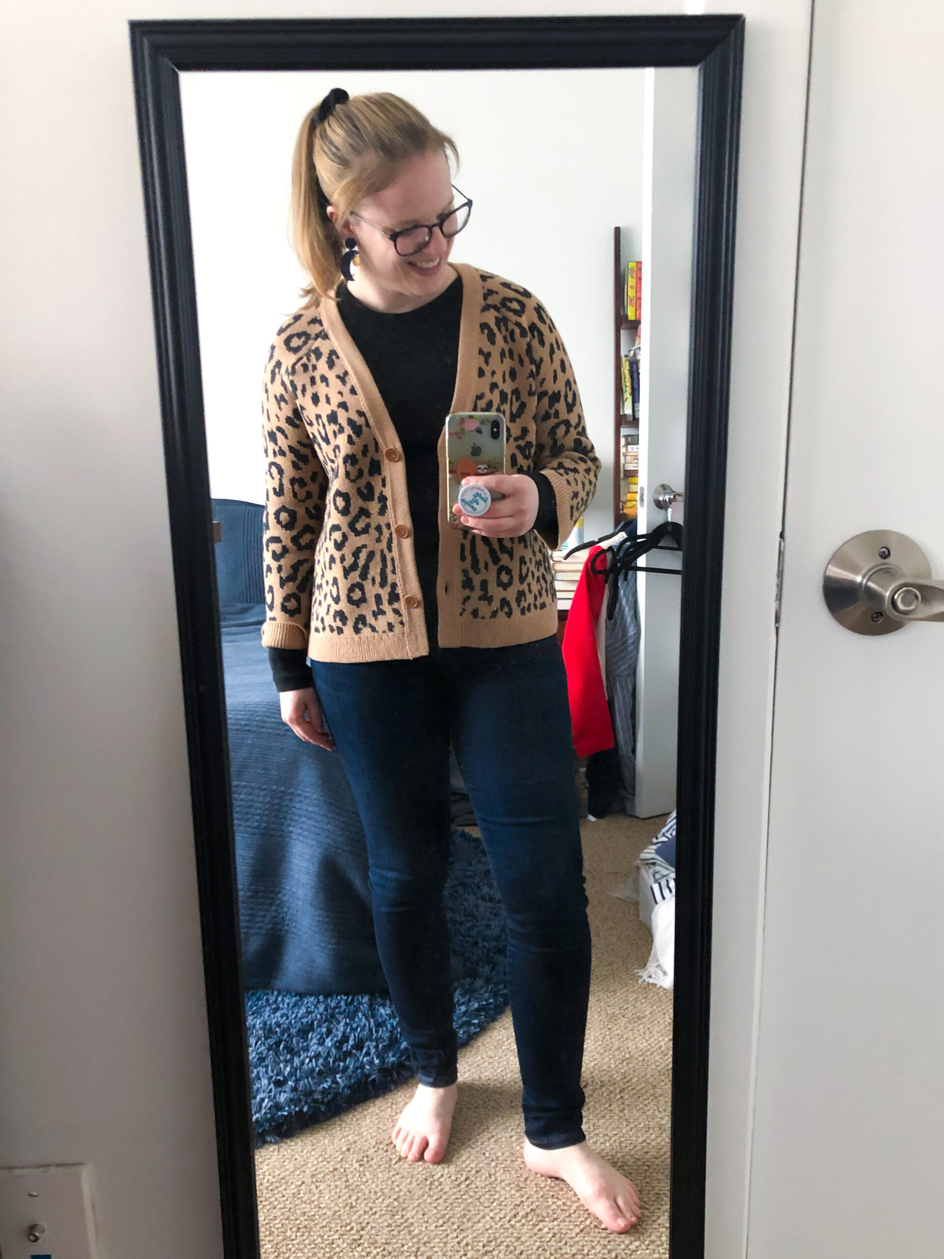 woman blogger wearing leopard cardigan