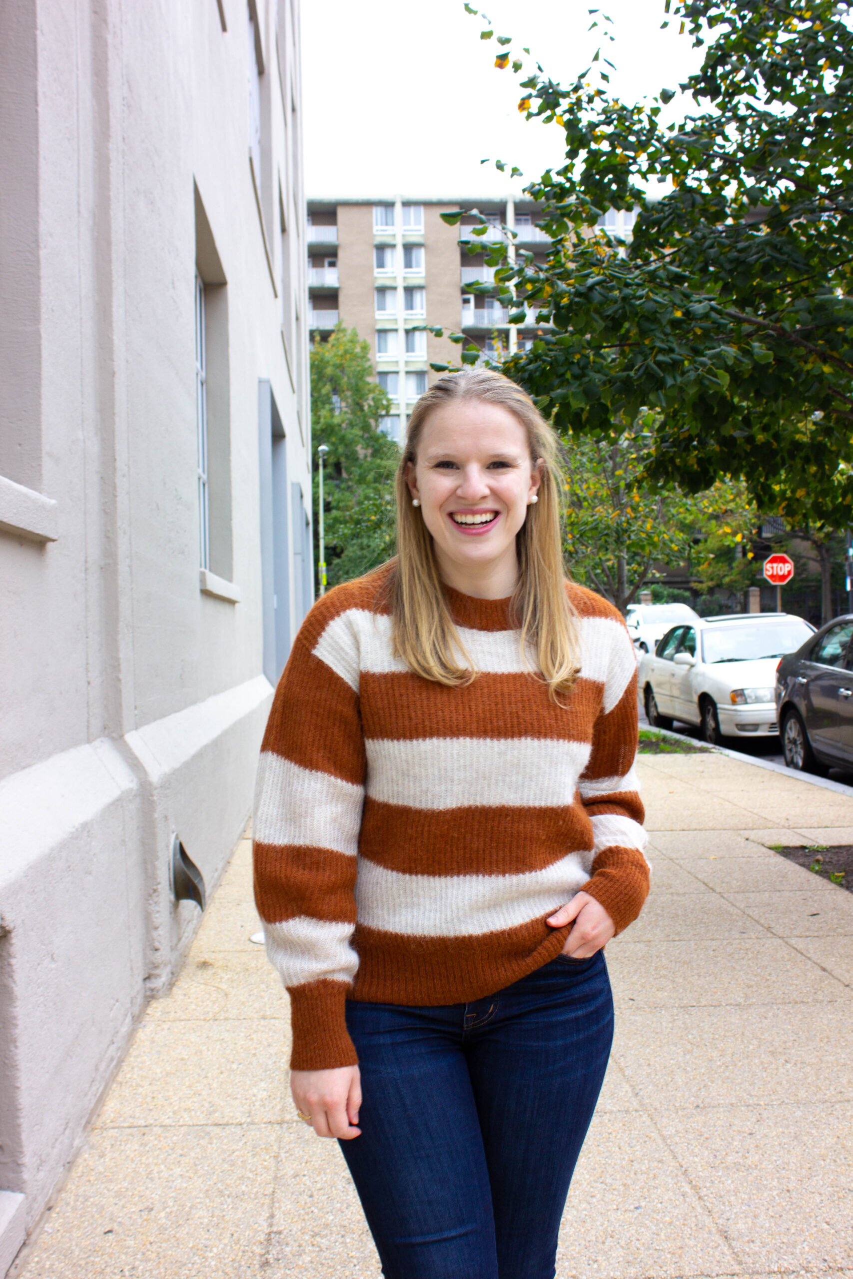 woman blogger wearing Everlane striped sweater in fall colors