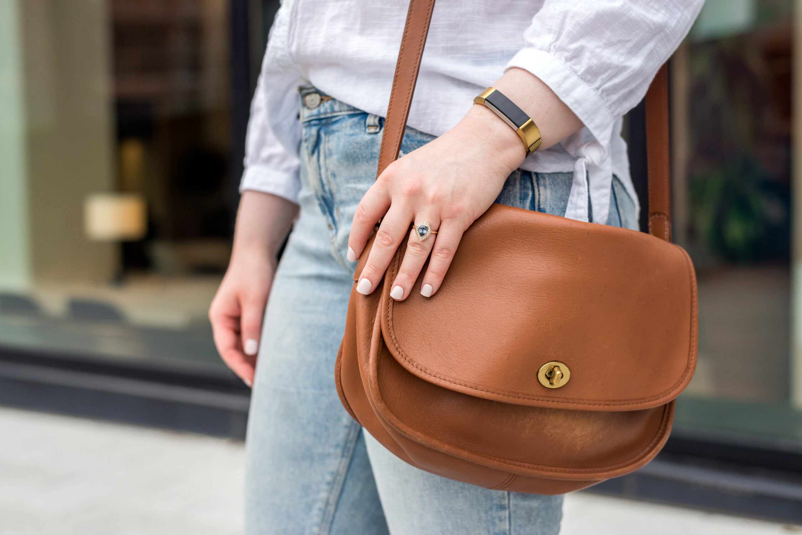 Woman carrying coach classic city bag