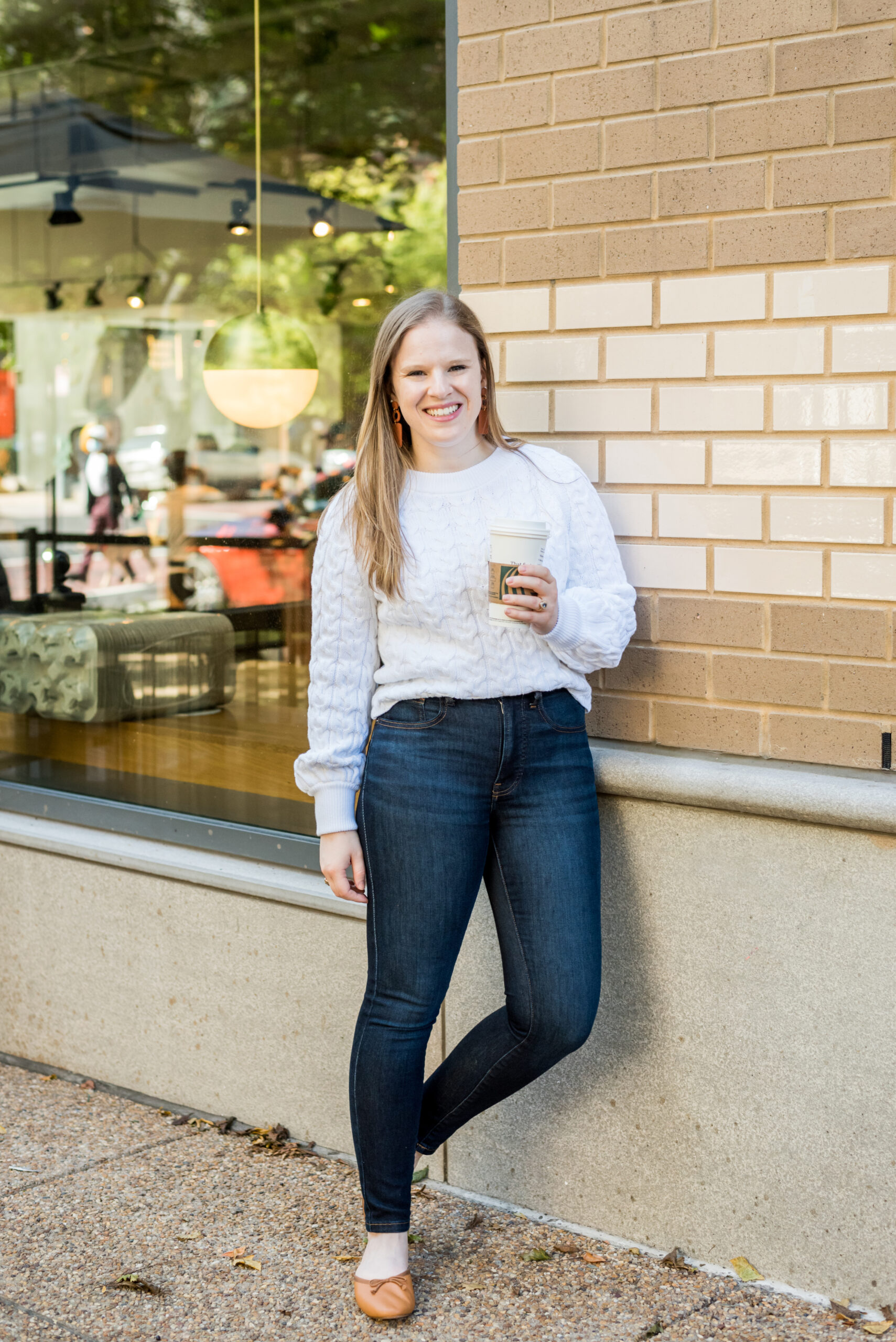 woman wearing j.crew cable knit relaxed sweater