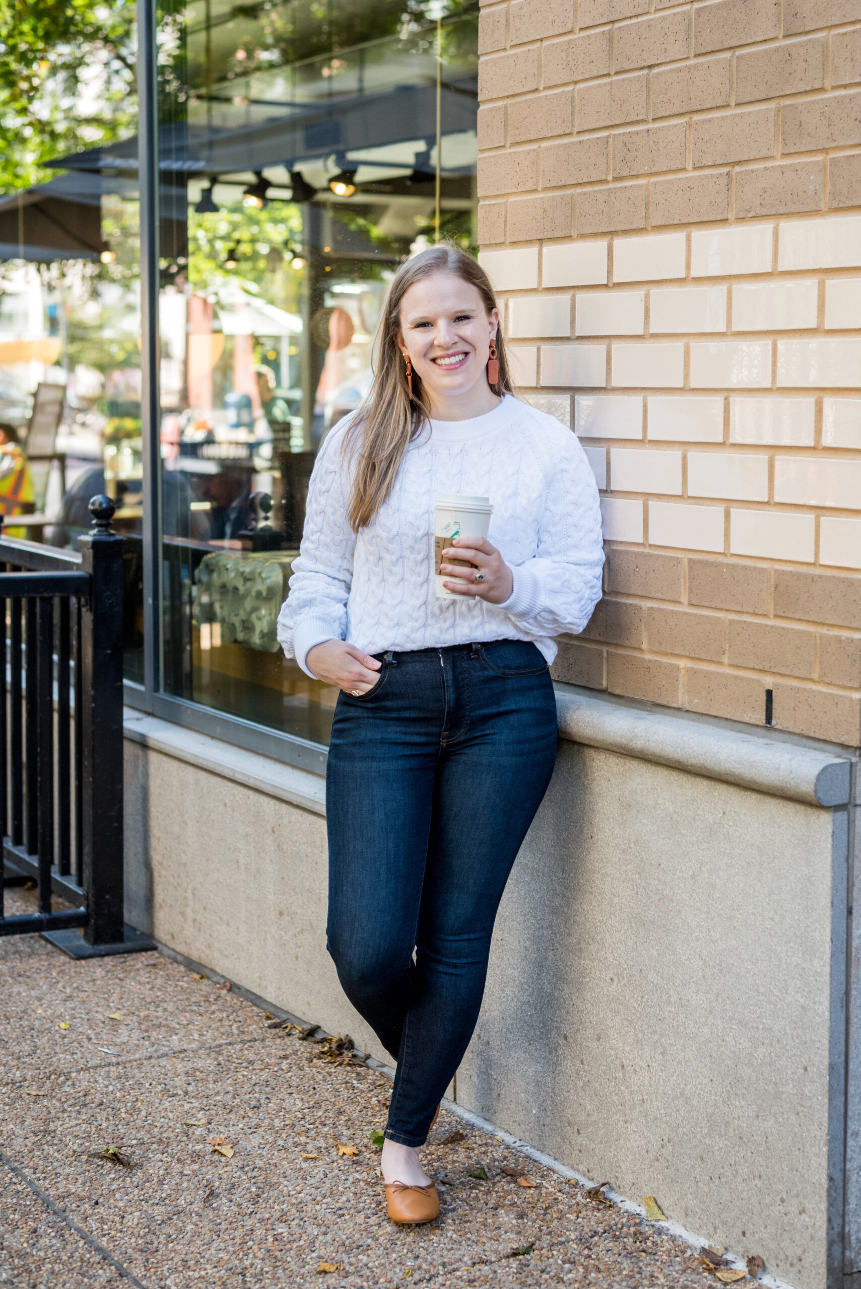 woman showing How to Style White Sweaters with jeans 